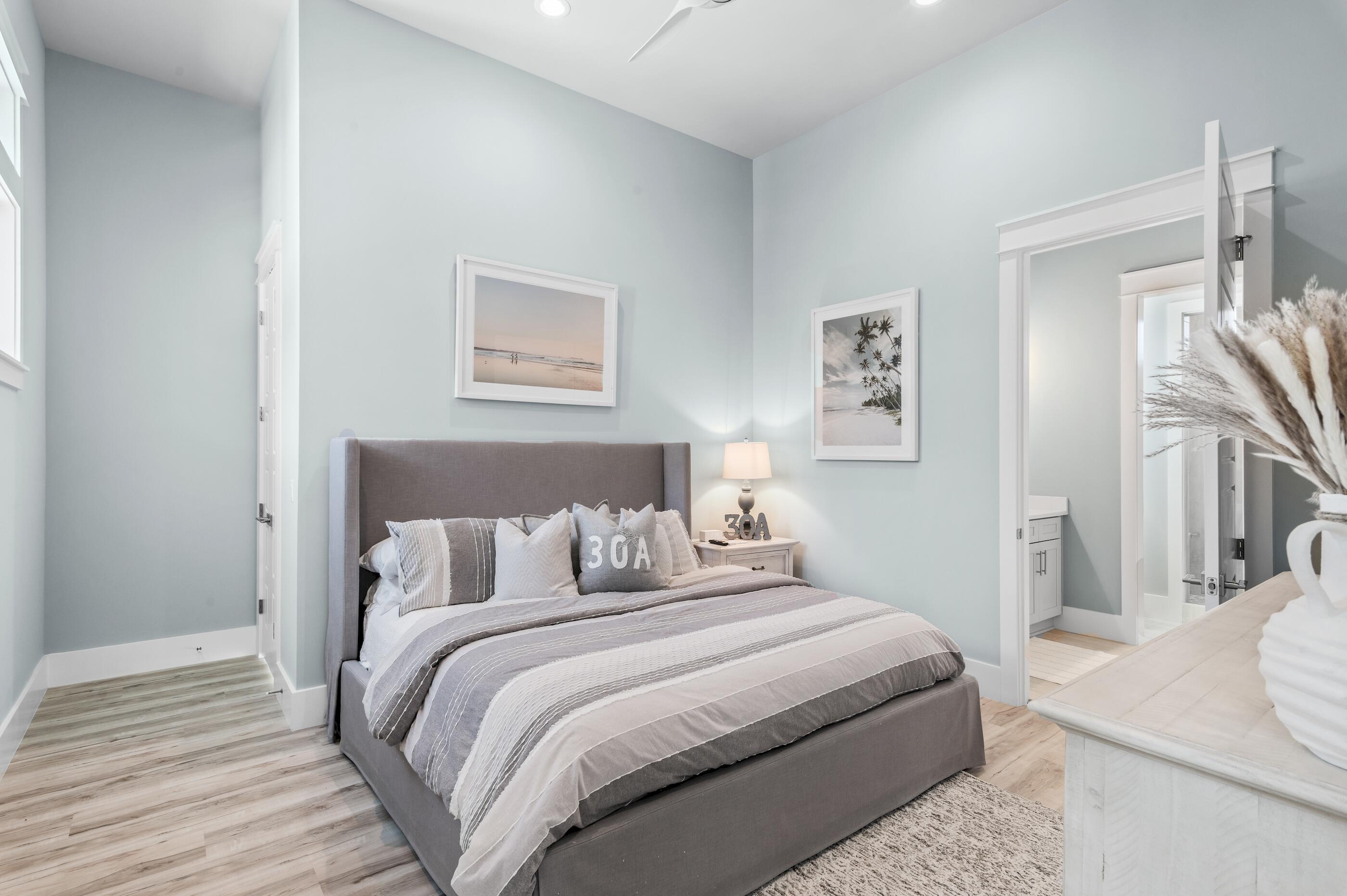 88 Beth Lane Santa Rosa Beach, FL 32459 - Photo 44 of 79 a bedroom with a bed and a wooden floor