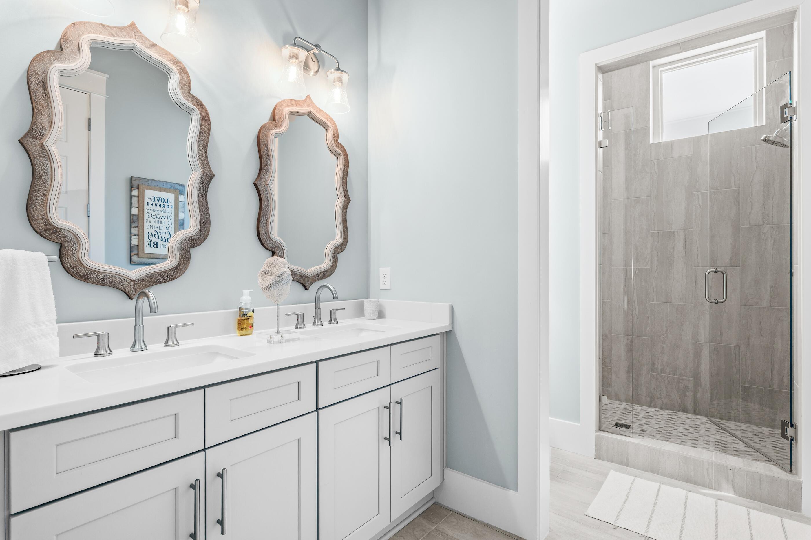 88 Beth Lane Santa Rosa Beach, FL 32459 - Photo 45 of 79 a bathroom with a double vanity sink mirror and shower