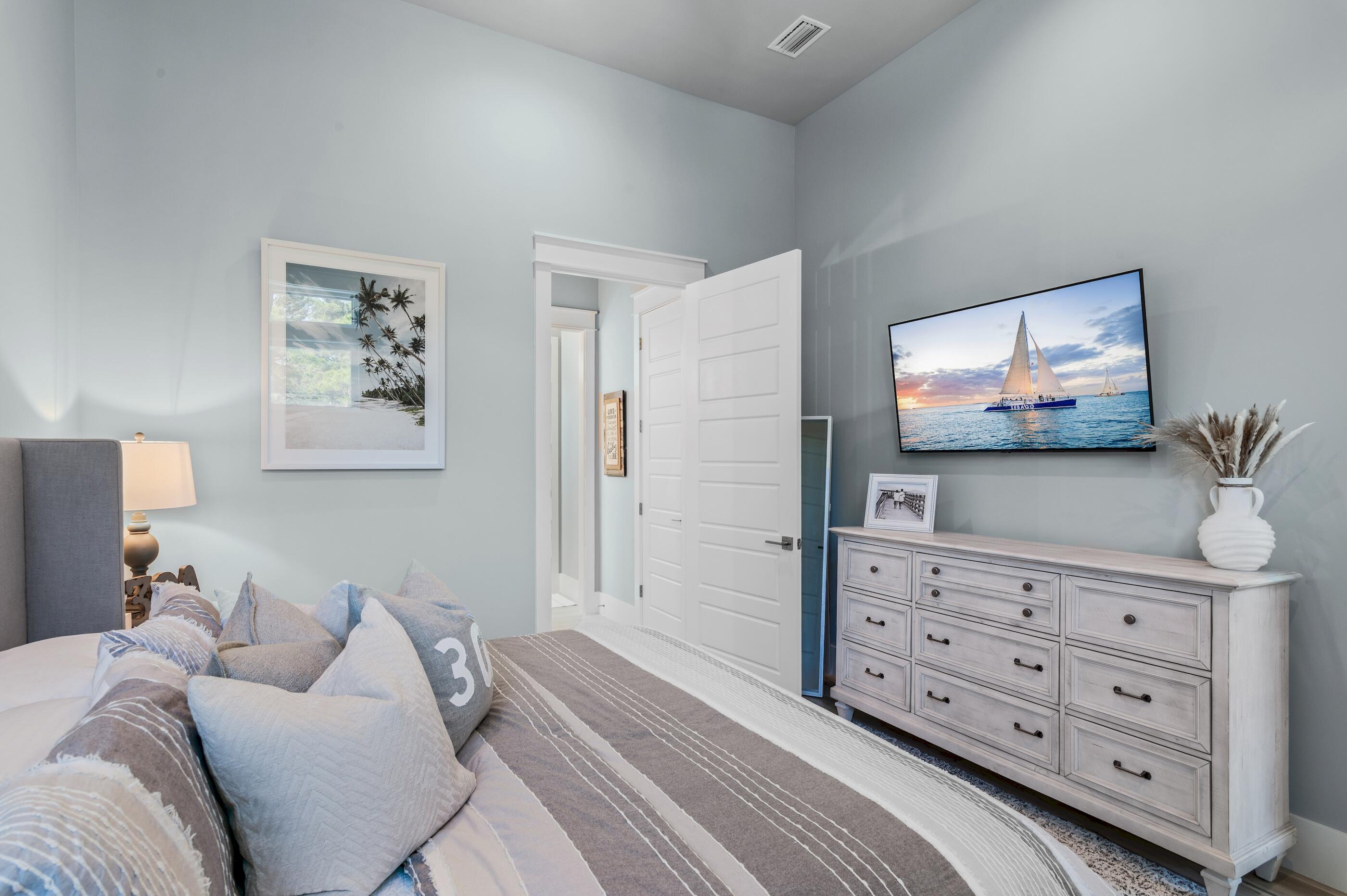 88 Beth Lane Santa Rosa Beach, FL 32459 - Photo 46 of 79 a bedroom with a bed and a television