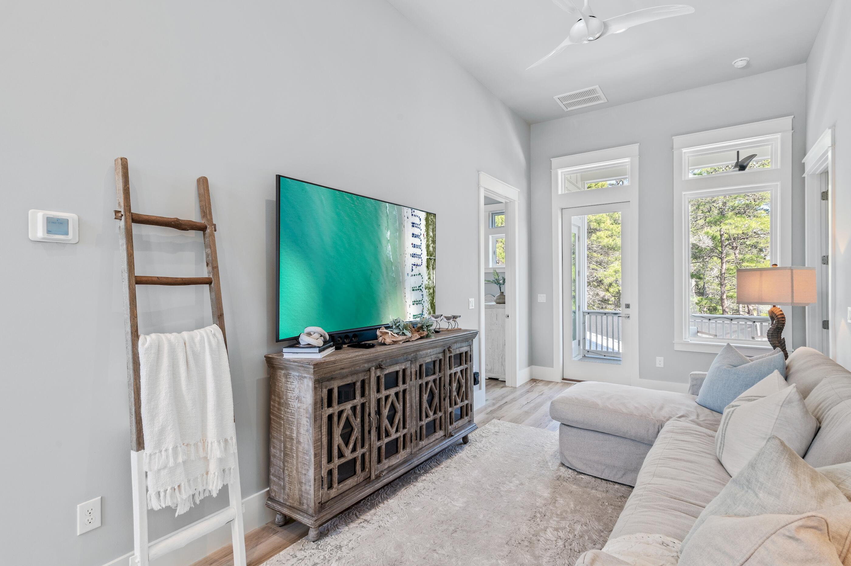 88 Beth Lane Santa Rosa Beach, FL 32459 - Photo 49 of 79 a living room with furniture and a flat screen tv