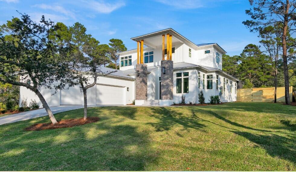 88 Beth Lane Santa Rosa Beach, FL 32459 - Photo 5 of 79 a front view of a house with a yard