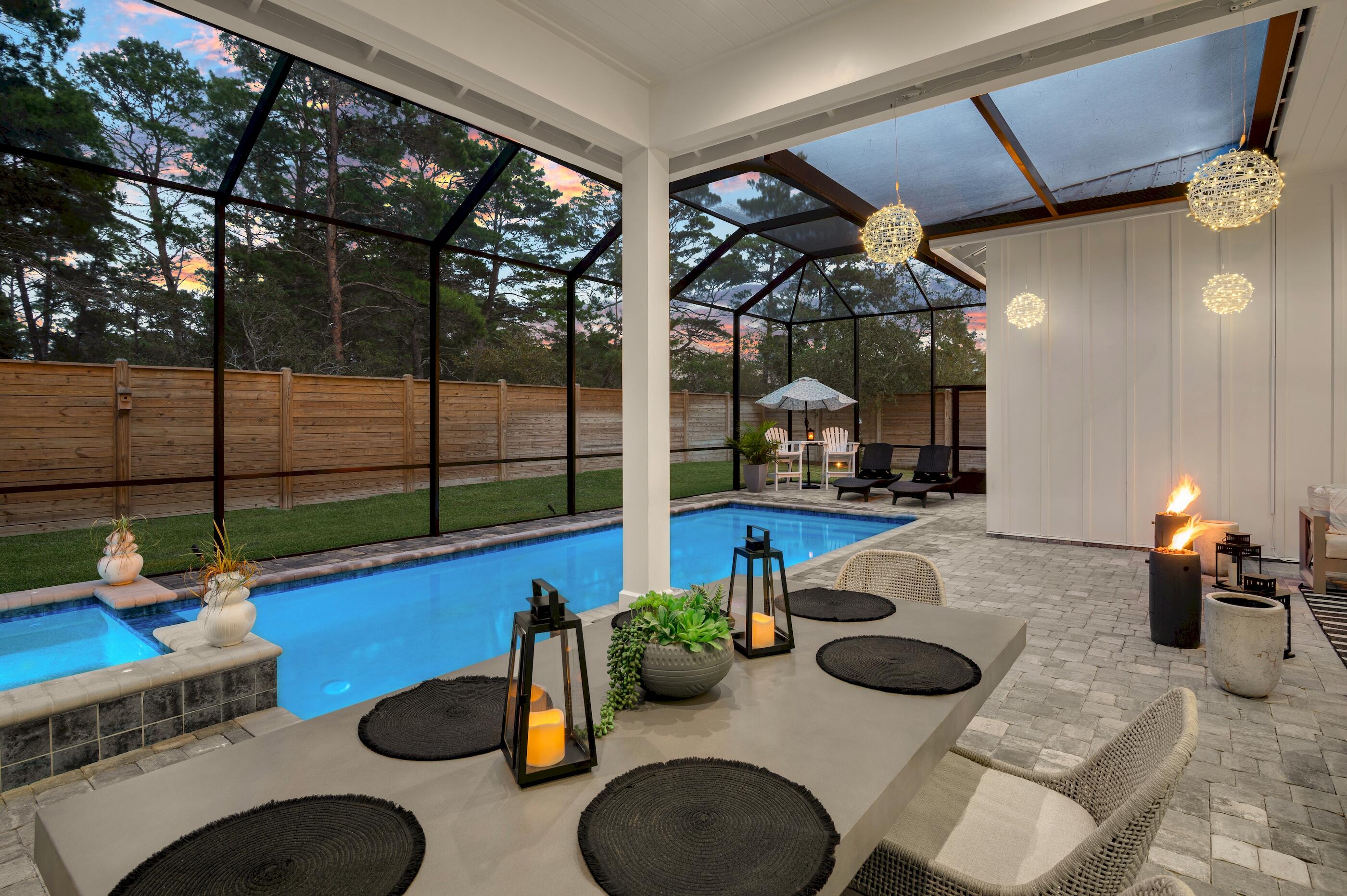 88 Beth Lane Santa Rosa Beach, FL 32459 - Photo 53 of 79 a dining room with furniture and a floor to ceiling window