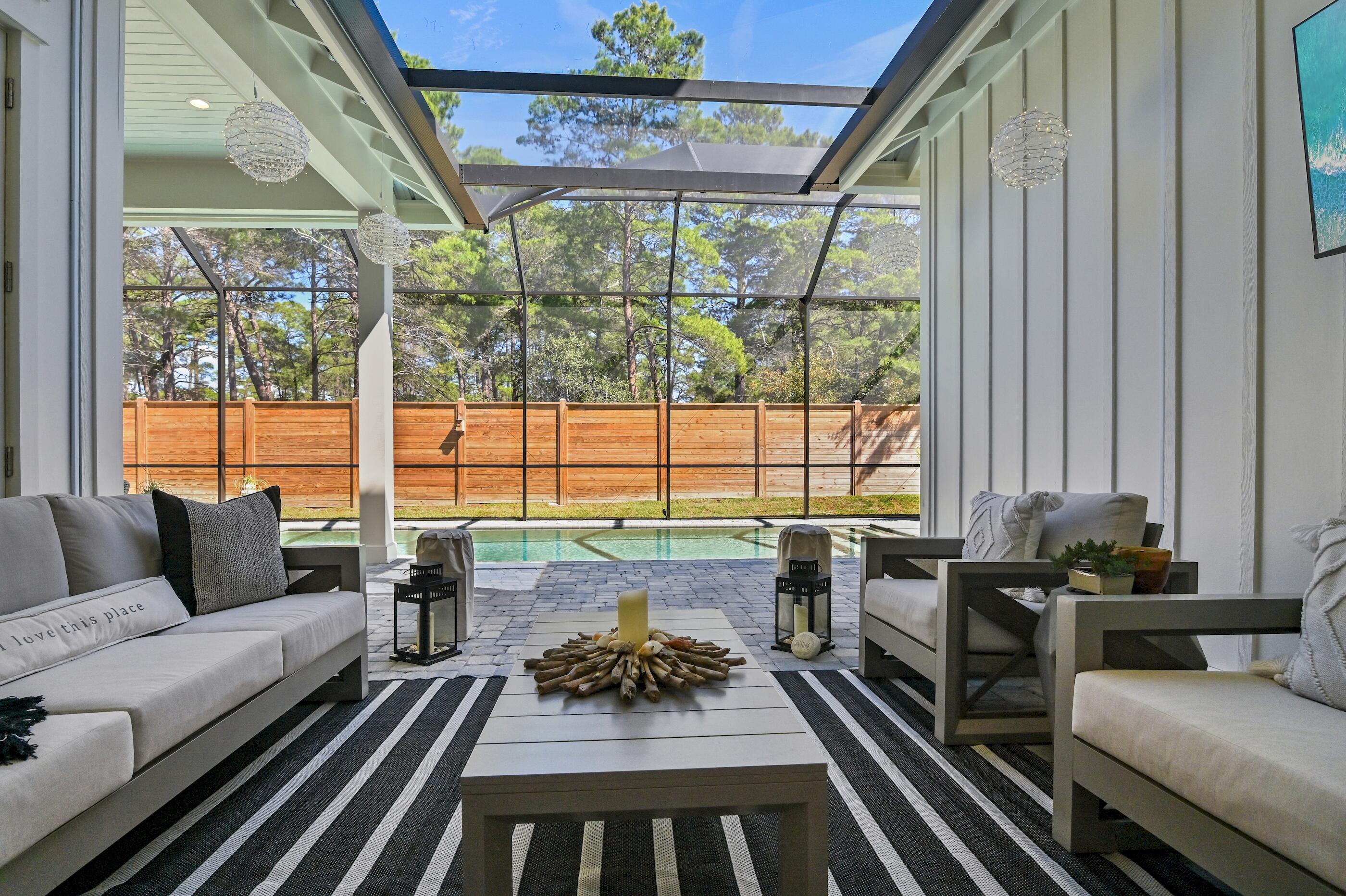 88 Beth Lane Santa Rosa Beach, FL 32459 - Photo 54 of 79 a living room with furniture and a large window