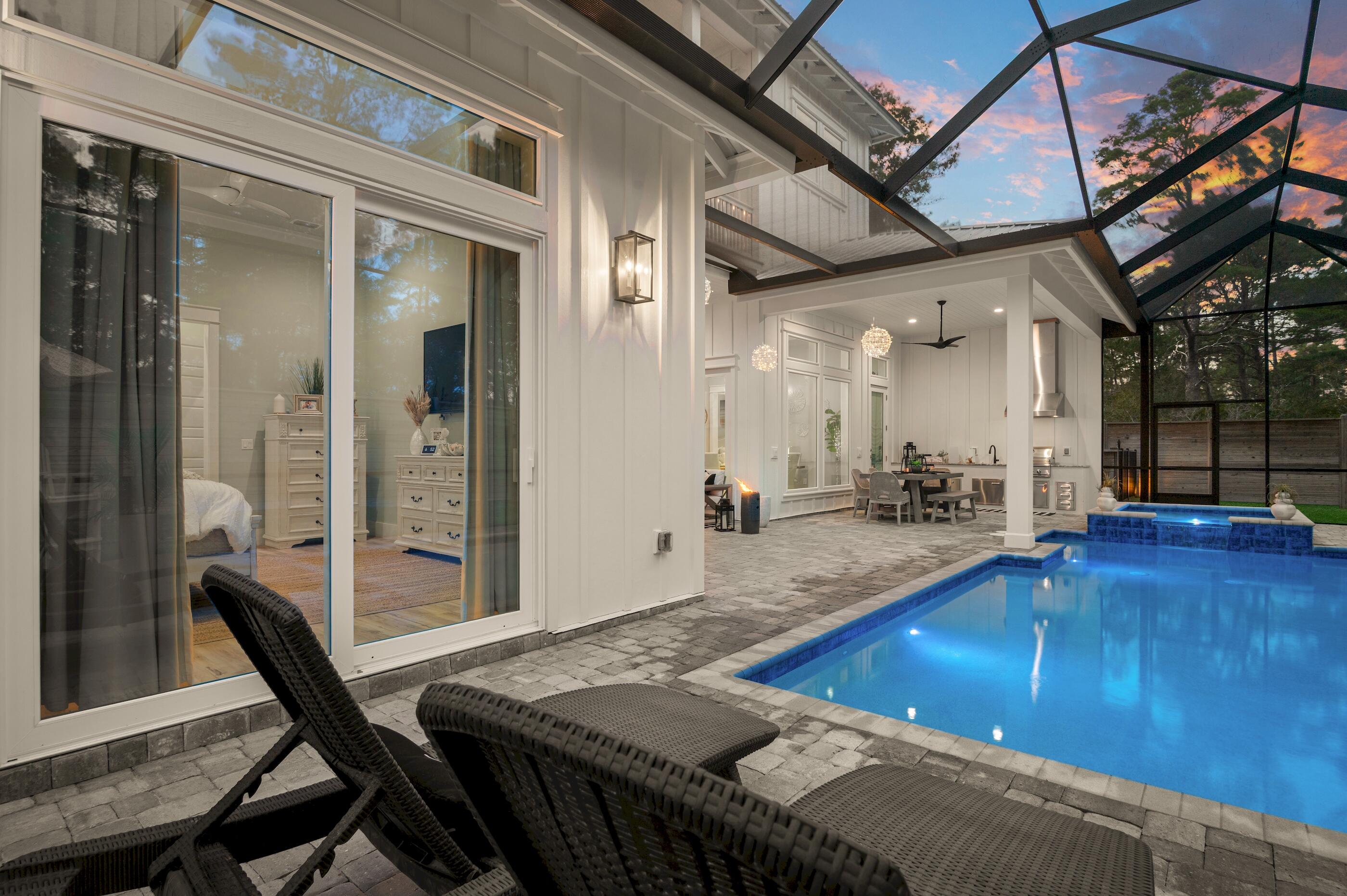 88 Beth Lane Santa Rosa Beach, FL 32459 - Photo 66 of 79 a view of a dining room with furniture and a chandelier