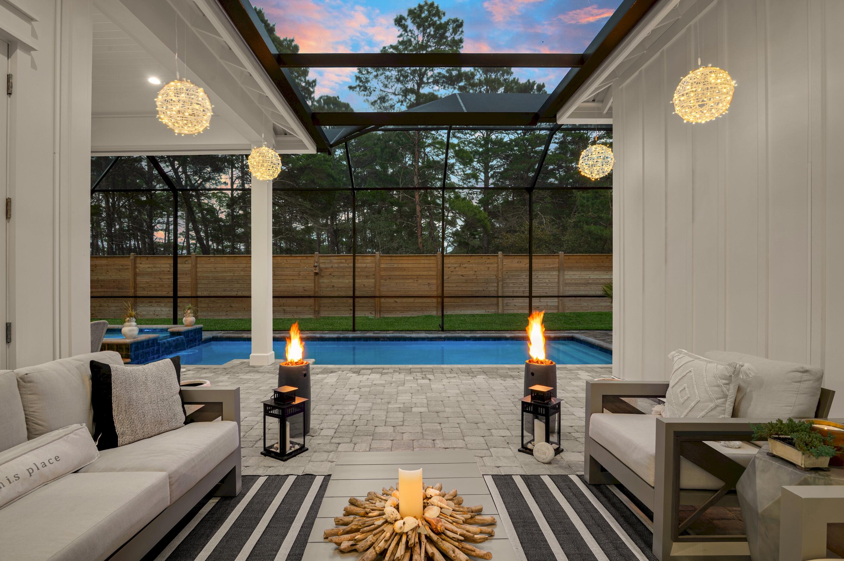 88 Beth Lane Santa Rosa Beach, FL 32459 - Photo 68 of 79 a living room with furniture and a floor to ceiling window