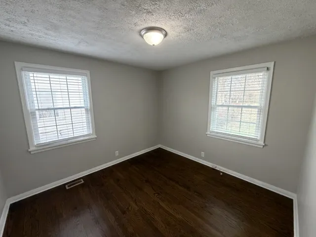 a bathroom with a bathtub a sink a toilet and a mirror