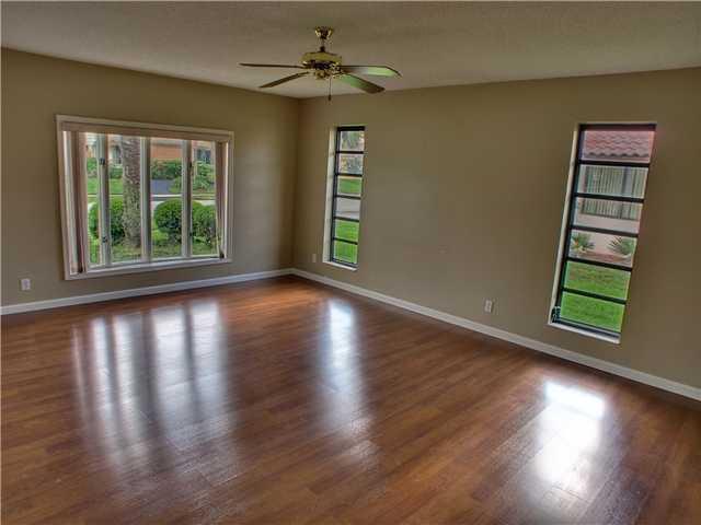 1400 Southwest 2nd Street Boca Raton, FL 33486 - Photo 6 of 9 a view of a livingroom with wooden floor and a window