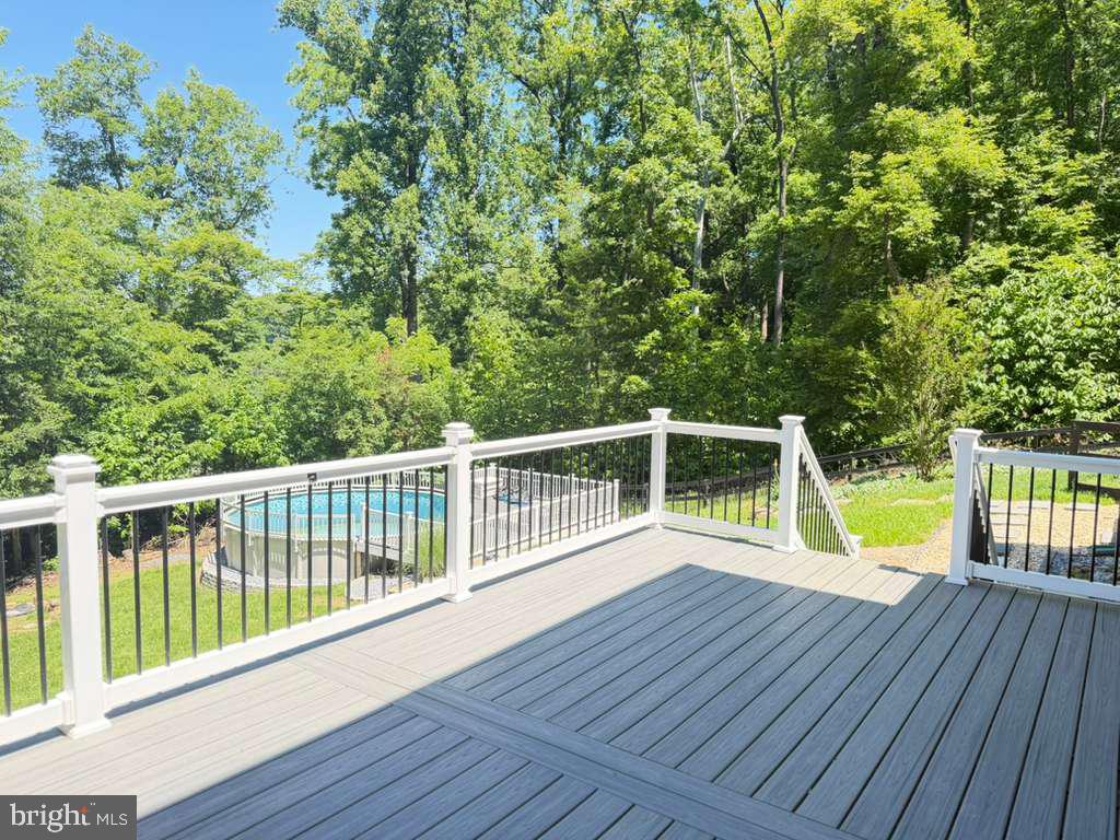 6348 Quinn Road Frederick, MD 21701 - Photo 27 of 28 Serene deck overlooking lush greenery.