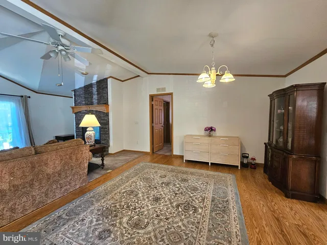 a bedroom with bed and wooden floor