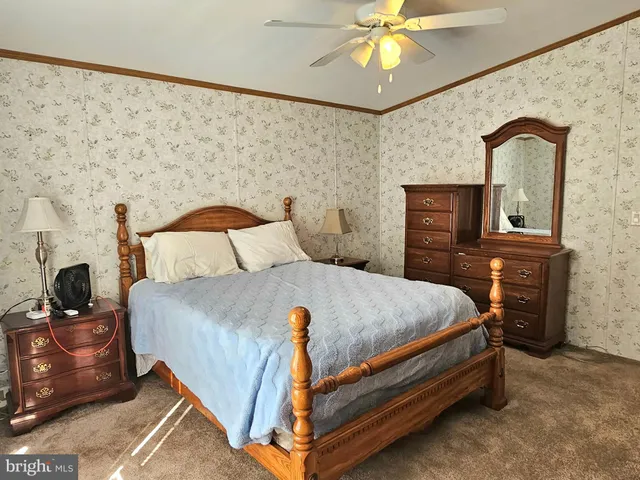 a bedroom with a bed and a table