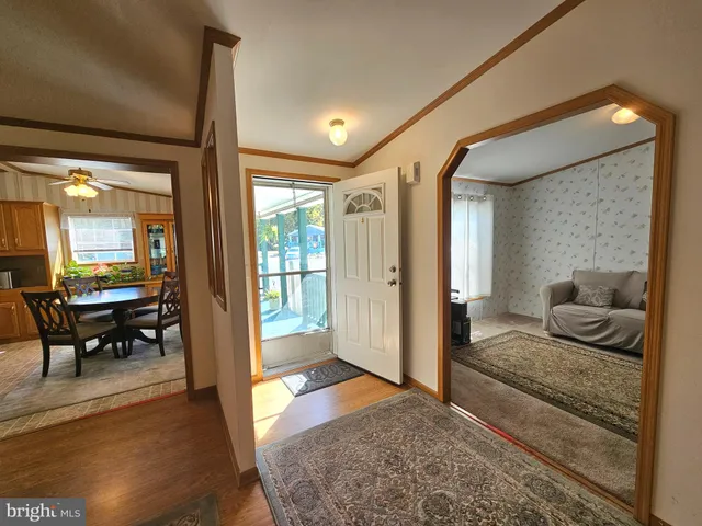 a living room with furniture and a rug