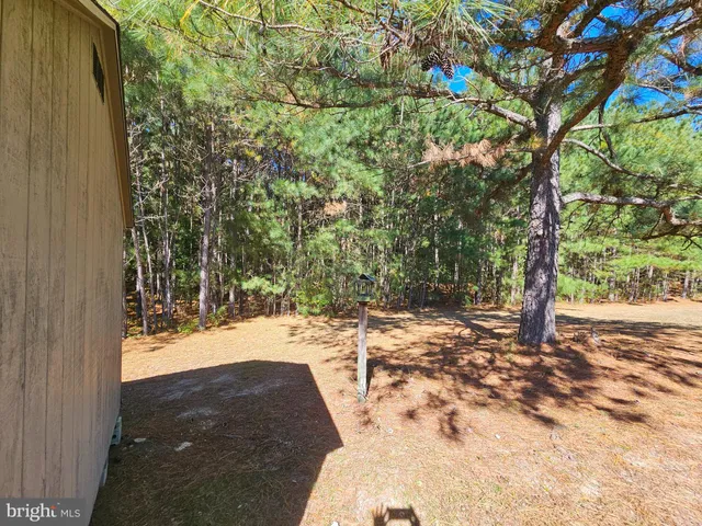 a view of a house with a yard porch and sitting area