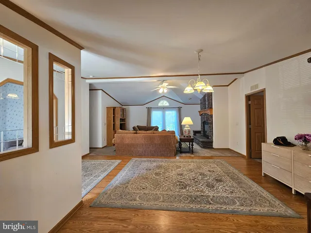 a view of a livingroom with furniture and windows