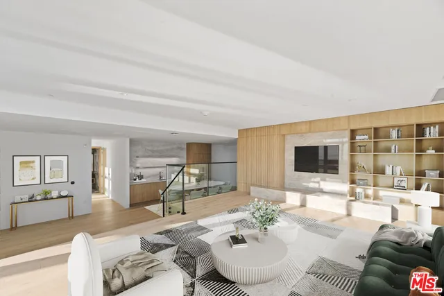 a view of a kitchen with furniture and wooden floor
