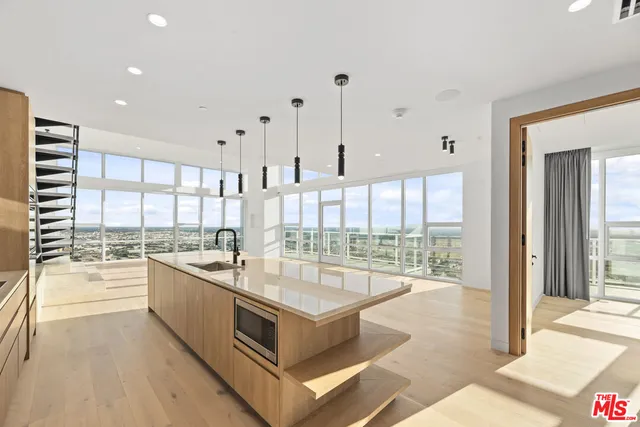 a bedroom with a large bed and a large window