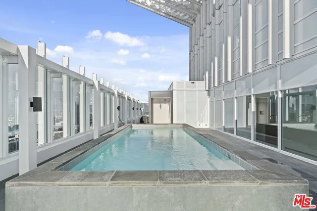 a kitchen with a sink a stove and a refrigerator