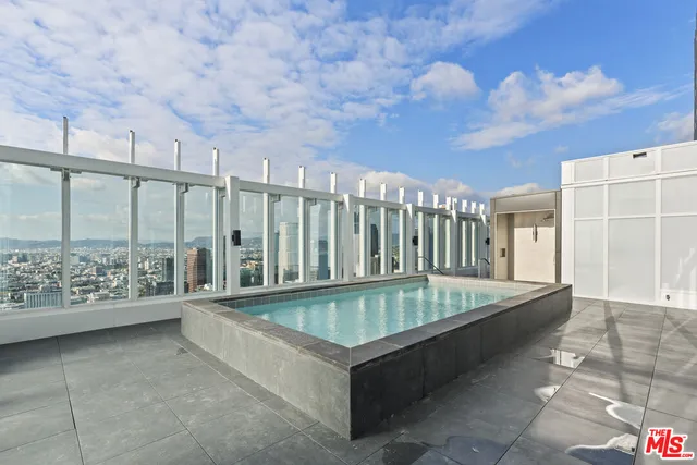 a room with gym equipment and a large window