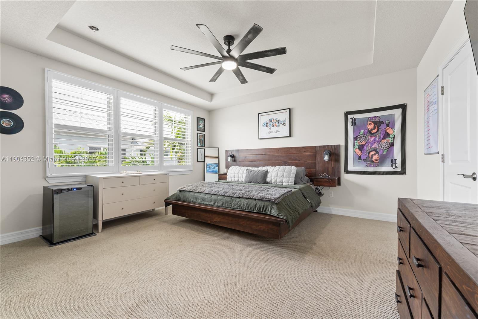 1030 Eucalyptus Drive, Unit 2 Hollywood, FL 33021 - Photo 11 of 22 a spacious bedroom with a bed and a large window