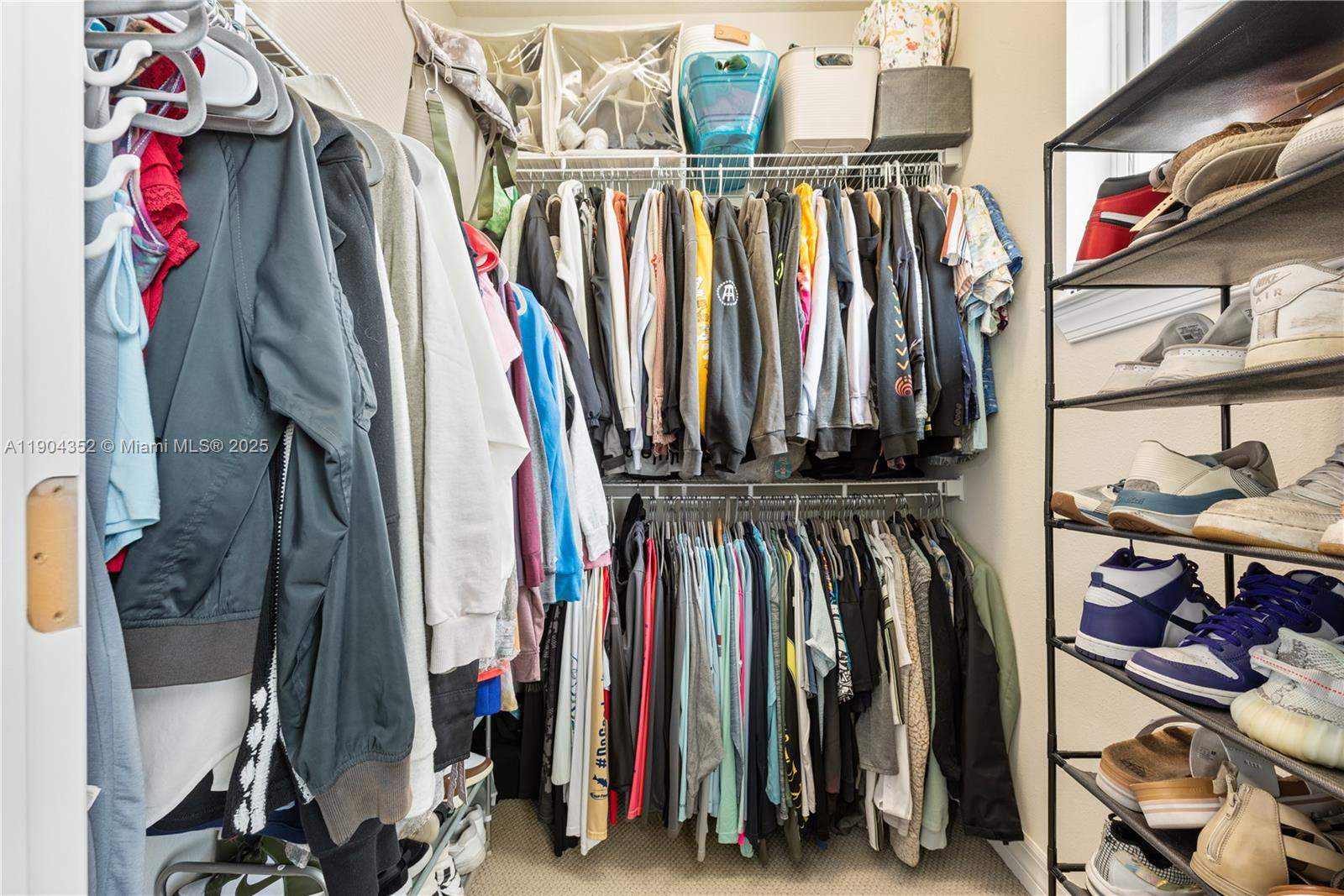 1030 Eucalyptus Drive, Unit 2 Hollywood, FL 33021 - Photo 13 of 22 a view of walk in closet with clothes