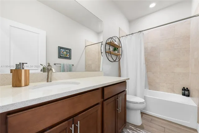 a bathroom with a sink a toilet and a bathtub