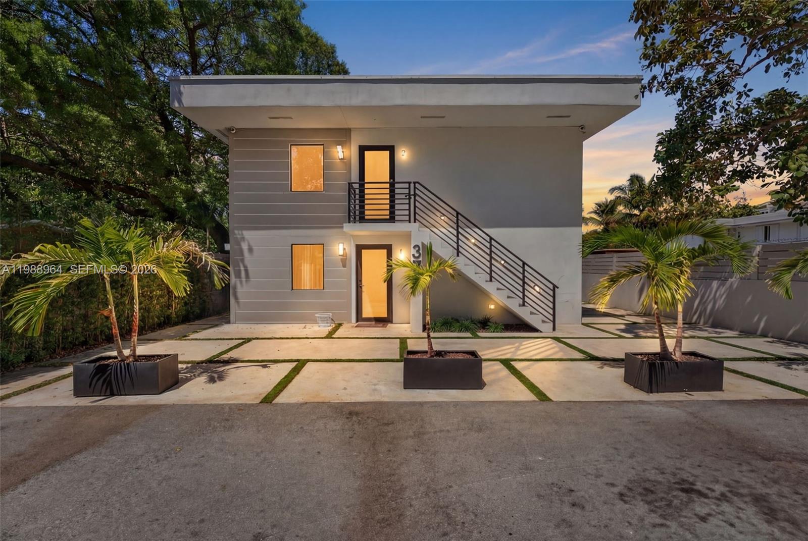 37 Northwest 59th Street, Unit 7 Miami, FL 33127 - Photo 1 of 19 front view of a house with a street
