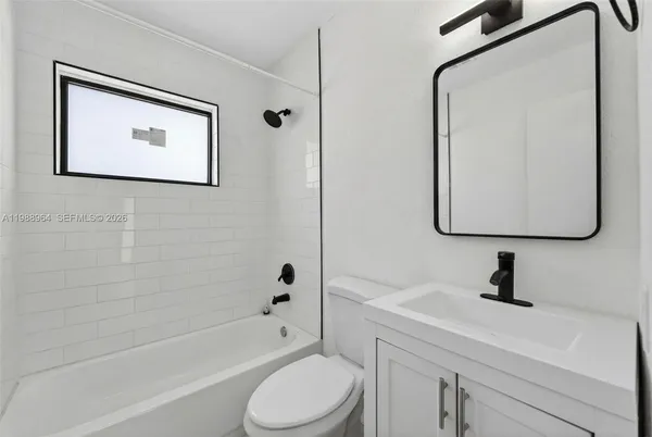 a bathroom with a toilet sink and a bathtub