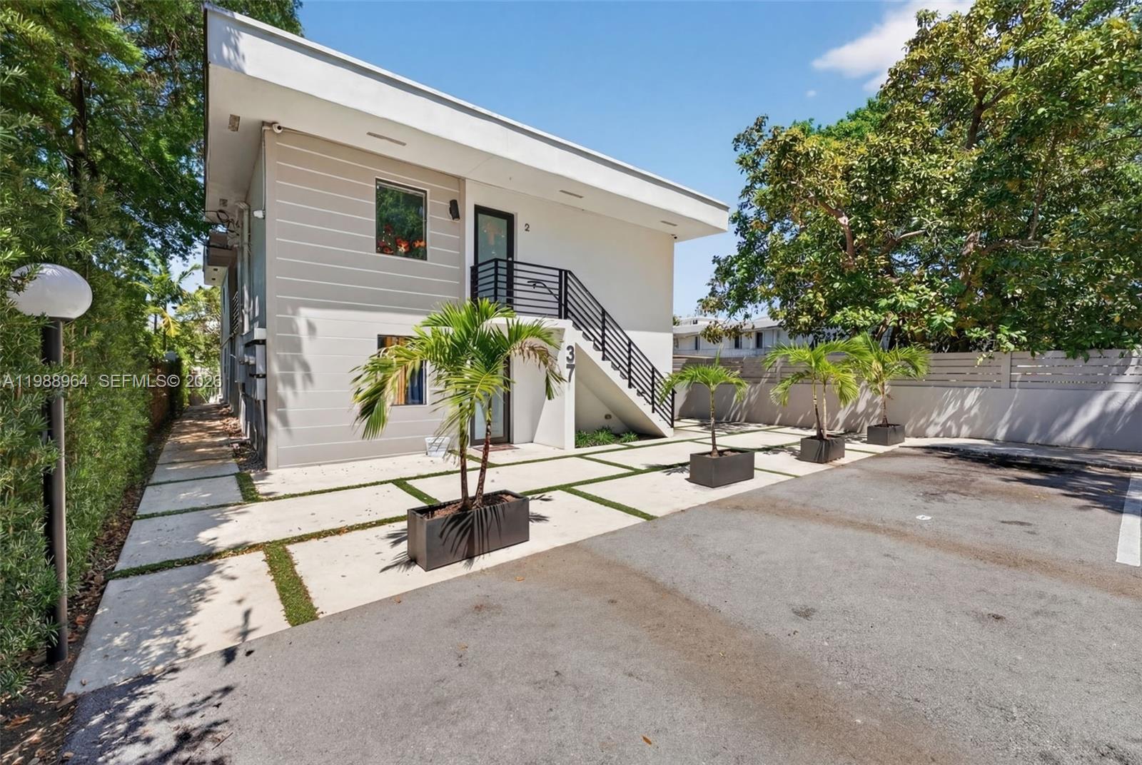 37 Northwest 59th Street, Unit 7 Miami, FL 33127 - Photo 18 of 19 a view of a house with backyard and sitting area