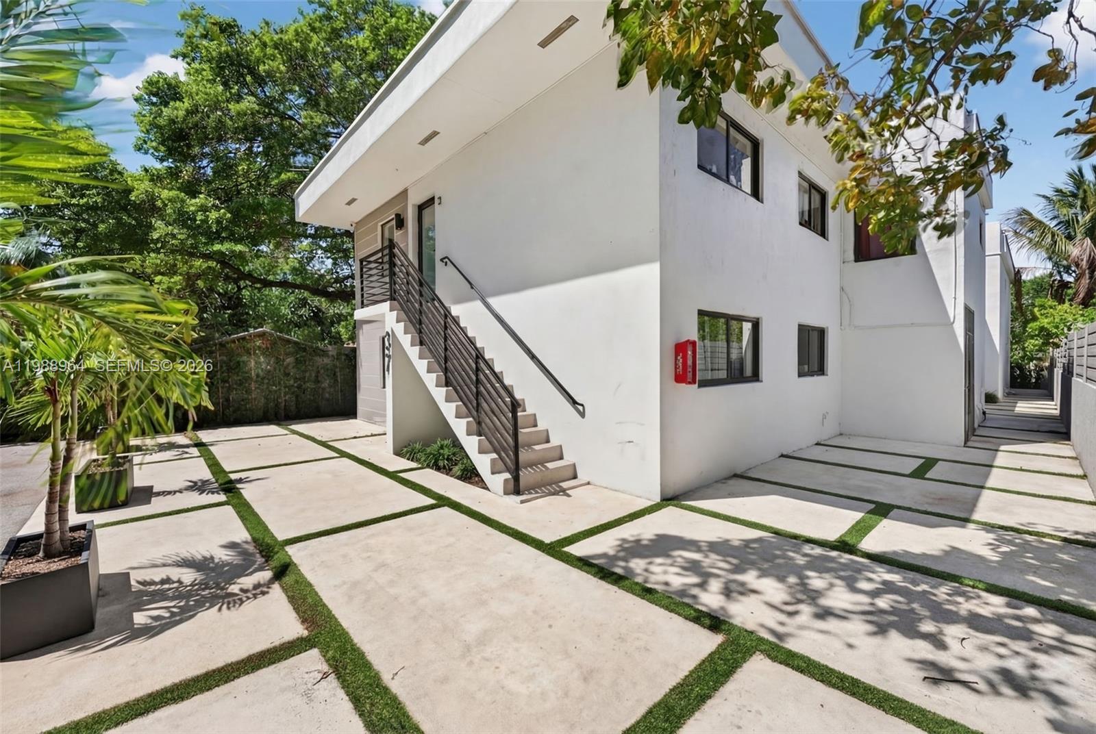 37 Northwest 59th Street, Unit 7 Miami, FL 33127 - Photo 2 of 19 a view of entryway along the house