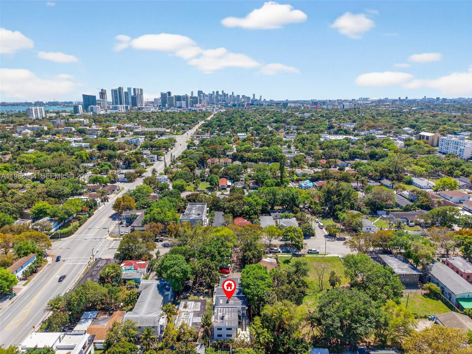 37 Northwest 59th Street, Unit 7 Miami, FL 33127 - Photo 5 of 19 an aerial view of a city with lots of residential buildings