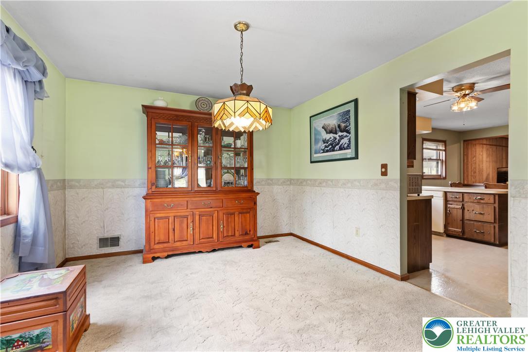 228 Cherry Hill Road Nazareth, PA 18064 - Photo 11 of 51 a view of a hallway with a chandelier
