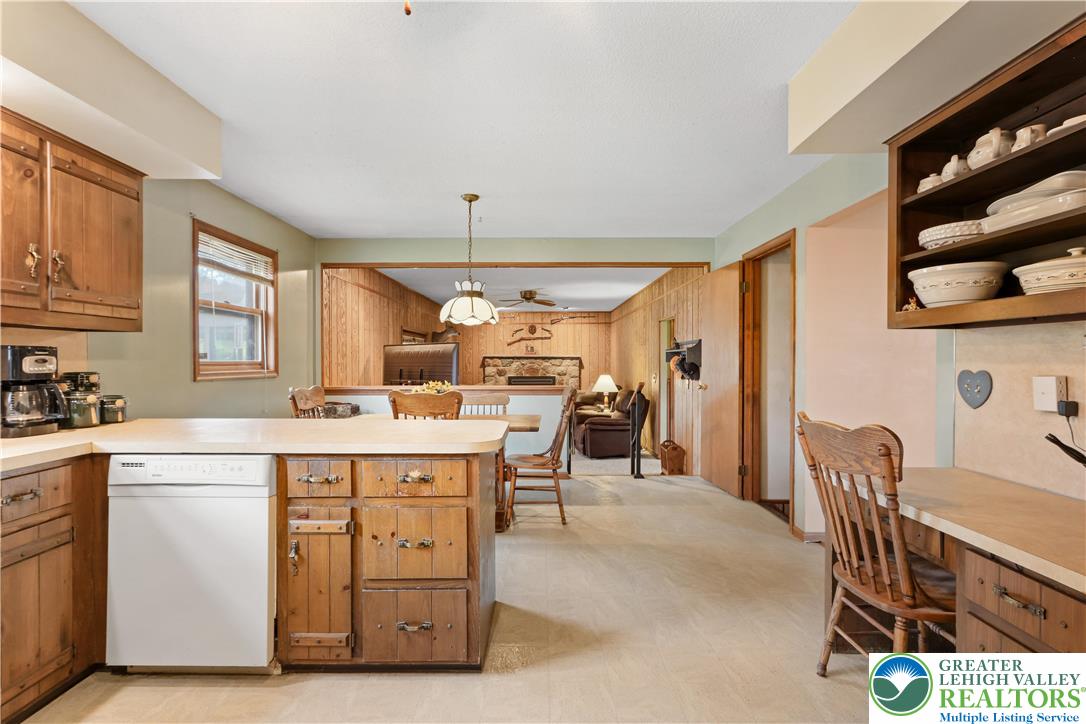 228 Cherry Hill Road Nazareth, PA 18064 - Photo 14 of 51 a kitchen with a table chairs refrigerator and cabinets