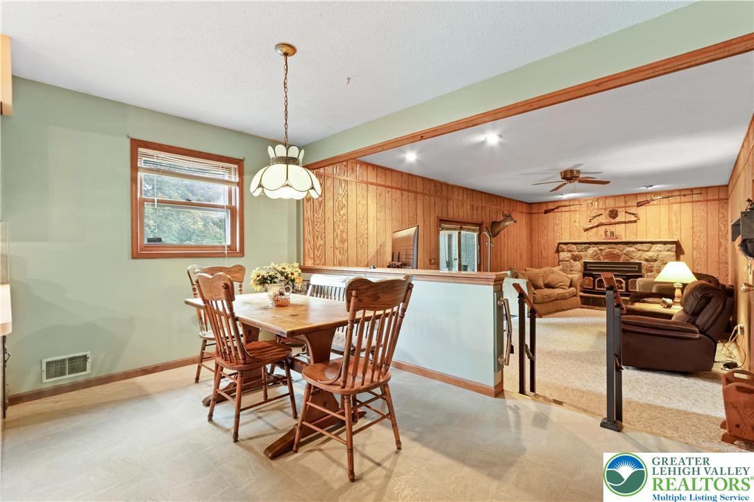 228 Cherry Hill Road Nazareth, PA 18064 - Photo 16 of 51 a view of a dining room with furniture window and wooden floor