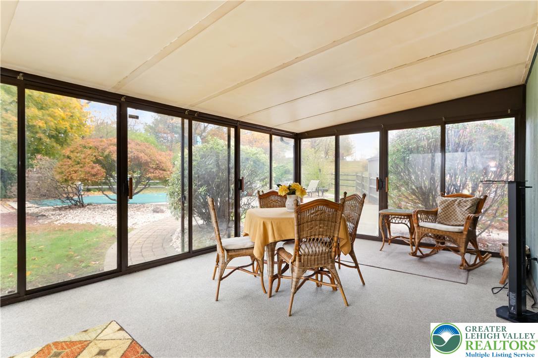 228 Cherry Hill Road Nazareth, PA 18064 - Photo 19 of 51 a living room with furniture and a floor to ceiling window
