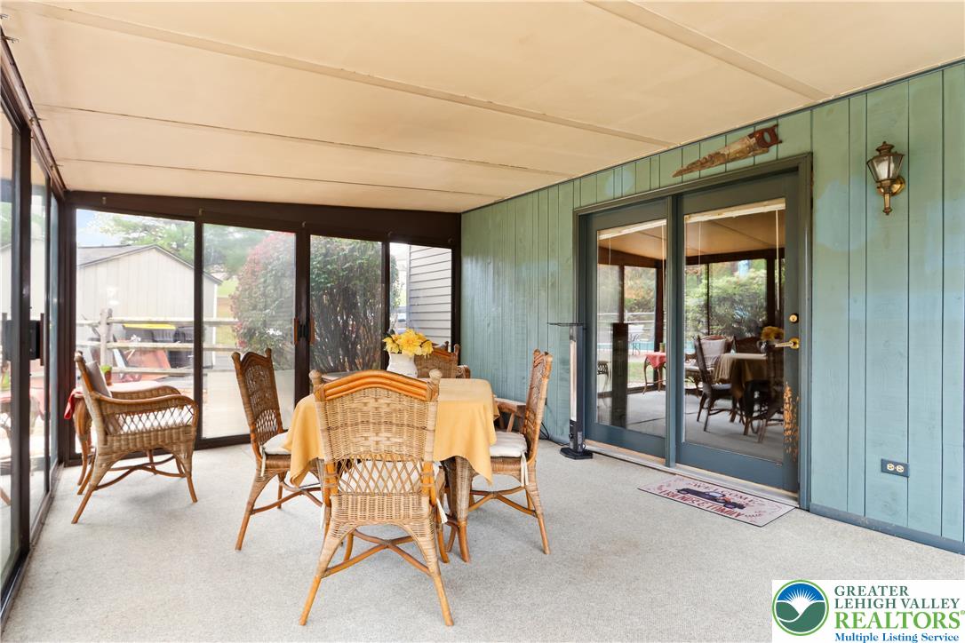 228 Cherry Hill Road Nazareth, PA 18064 - Photo 20 of 51 a dining room with furniture water view and a floor to ceiling window
