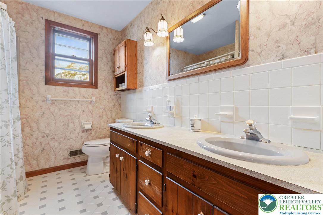 228 Cherry Hill Road Nazareth, PA 18064 - Photo 25 of 51 a bathroom with a sink and a mirror