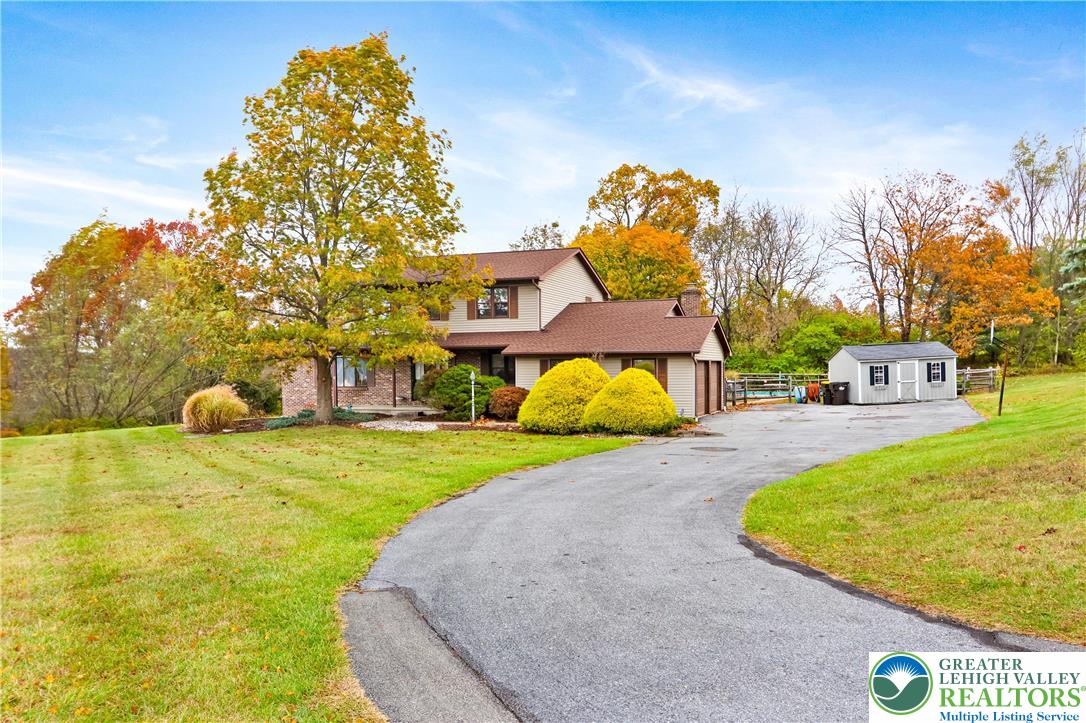 228 Cherry Hill Road Nazareth, PA 18064 - Photo 44 of 51 a swimming pool with a yard and trees in the background