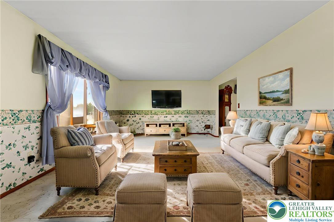 228 Cherry Hill Road Nazareth, PA 18064 - Photo 7 of 51 a living room with furniture and a flat screen tv