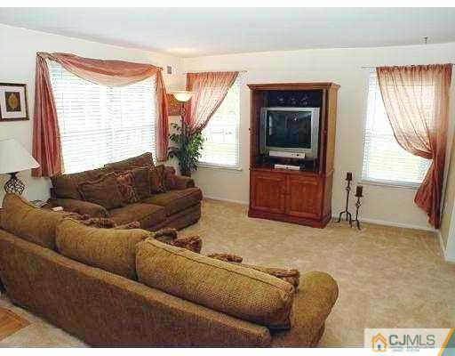 104 Hickory Road Somerset, NJ 08873 - Photo 2 of 10 a living room with furniture and a window