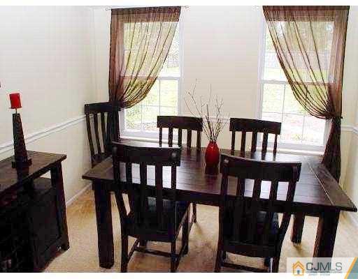 104 Hickory Road Somerset, NJ 08873 - Photo 3 of 10 a view of a dining room with furniture window and wooden floor