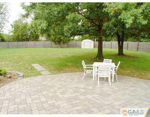 104 Hickory Road Somerset, NJ 08873 - Photo 8 of 10 a view of a house with backyard and a sitting area