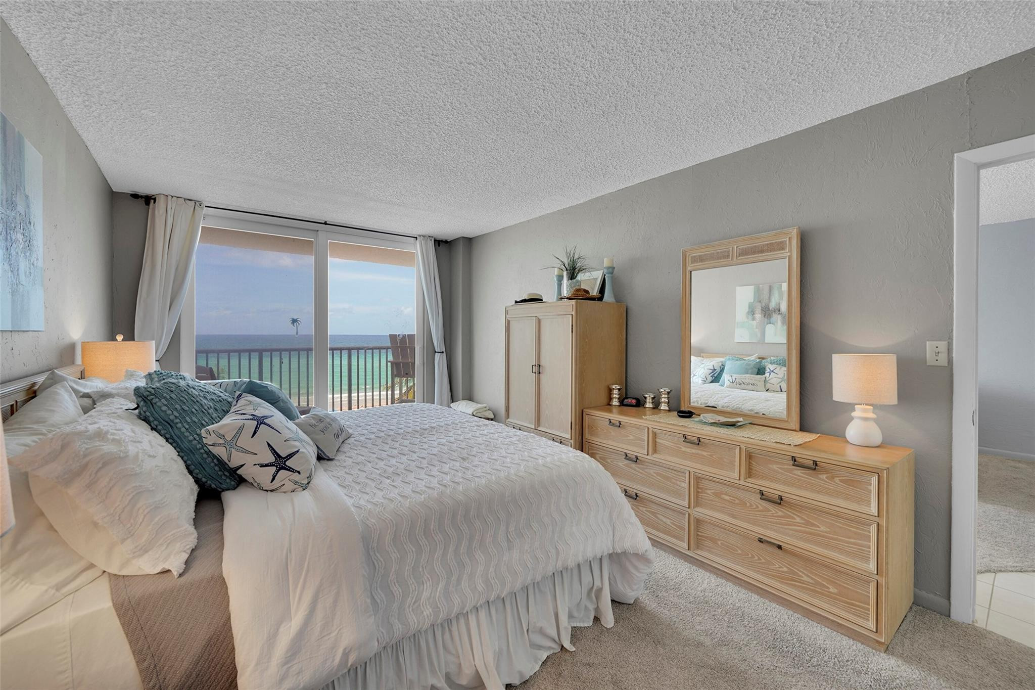 400 North Surf Road, Unit 503 Hollywood, FL 33019 - Photo 19 of 35 a bedroom with a bed and a dresser