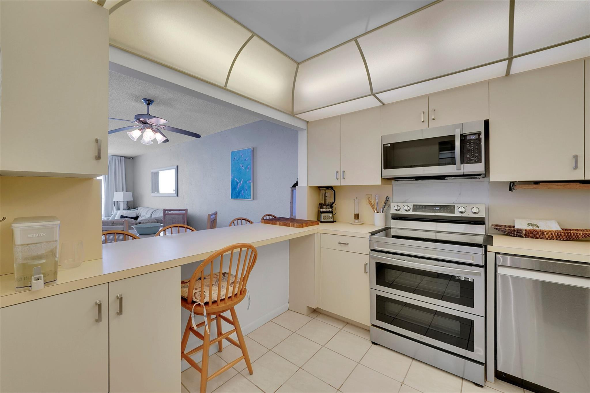 400 North Surf Road, Unit 503 Hollywood, FL 33019 - Photo 8 of 35 a kitchen with a sink cabinets and appliances