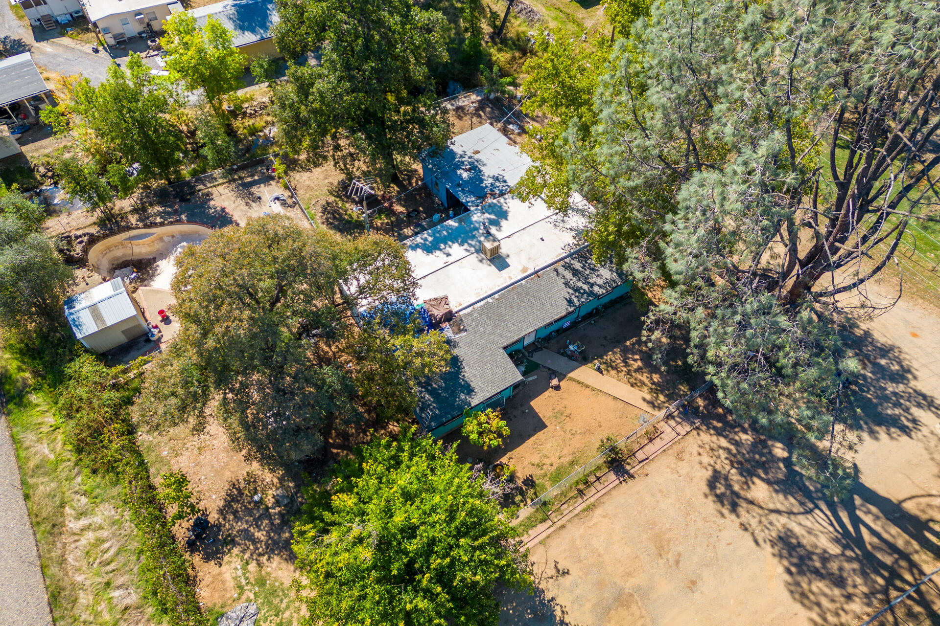 12125 Cinder Road Redding, CA 96003 - Photo 6 of 8 a view of outside house with a tree