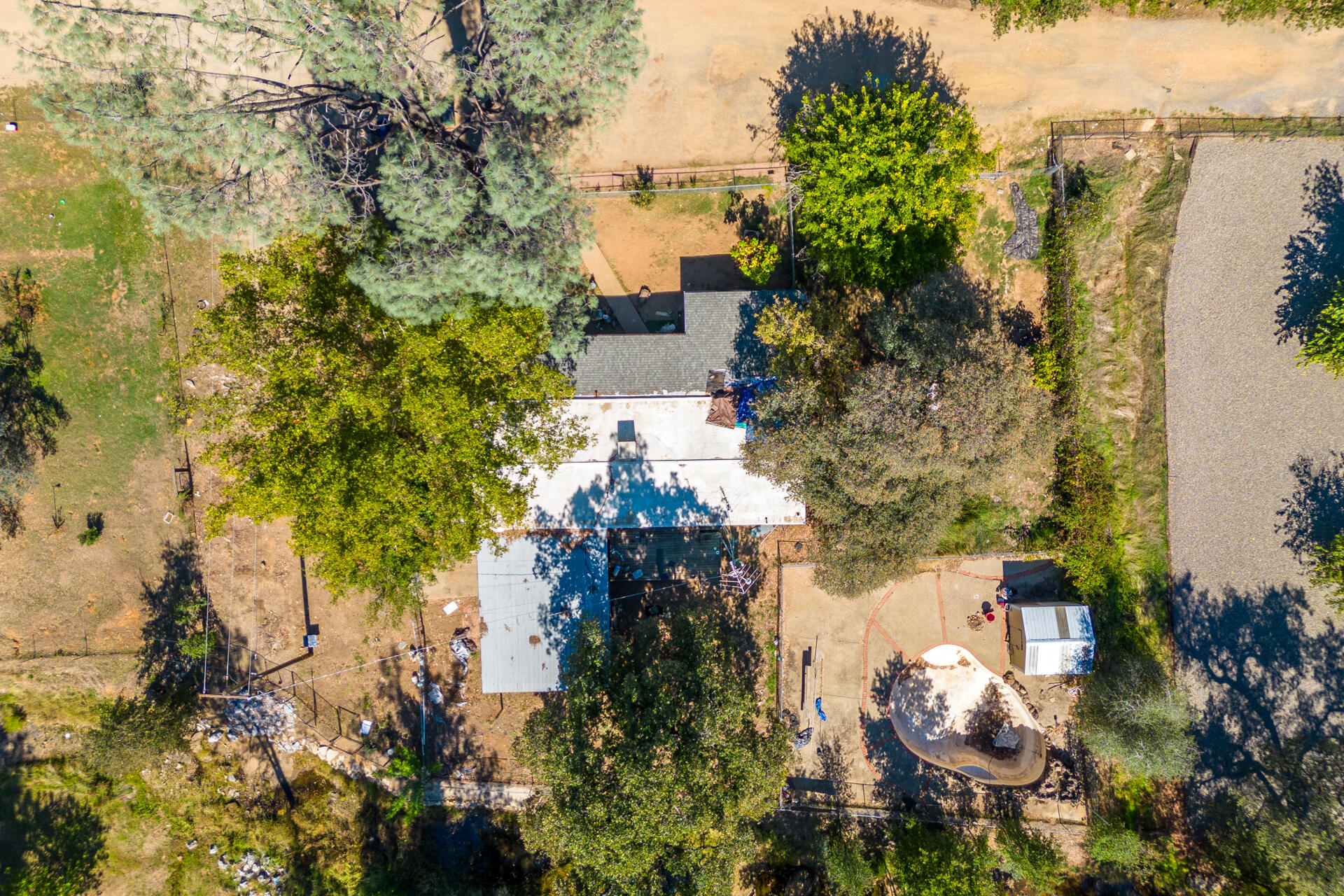 12125 Cinder Road Redding, CA 96003 - Photo 7 of 8 aerial view of a house with a yard and lake view