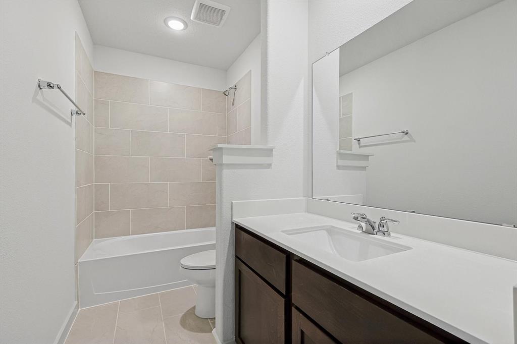 1714 Glacial Beech Place Forney, TX 75126 - Photo 23 of 25 Bathroom with vanity and washtub / shower combination