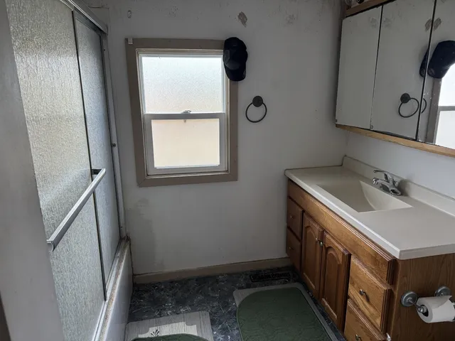 a kitchen with a stove and a refrigerator