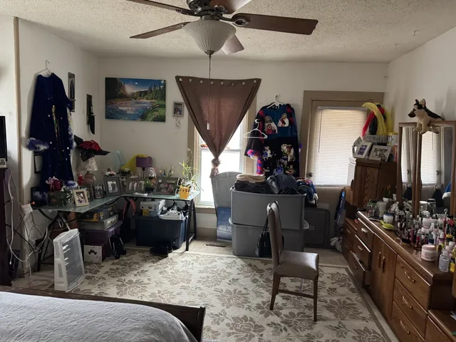 a bedroom with a bed and furniture