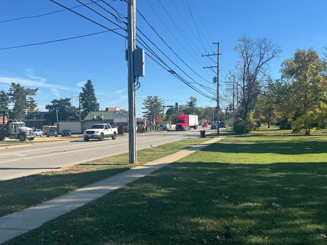 a view of a swimming pool and trees in the background