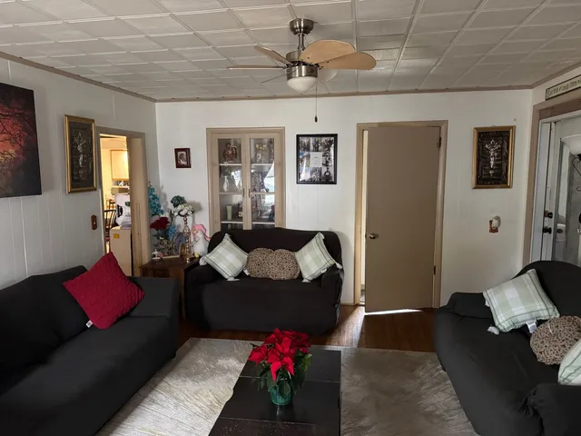 a room with furniture and a flat screen tv