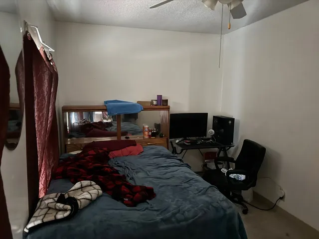 a living room with furniture chess board and a window